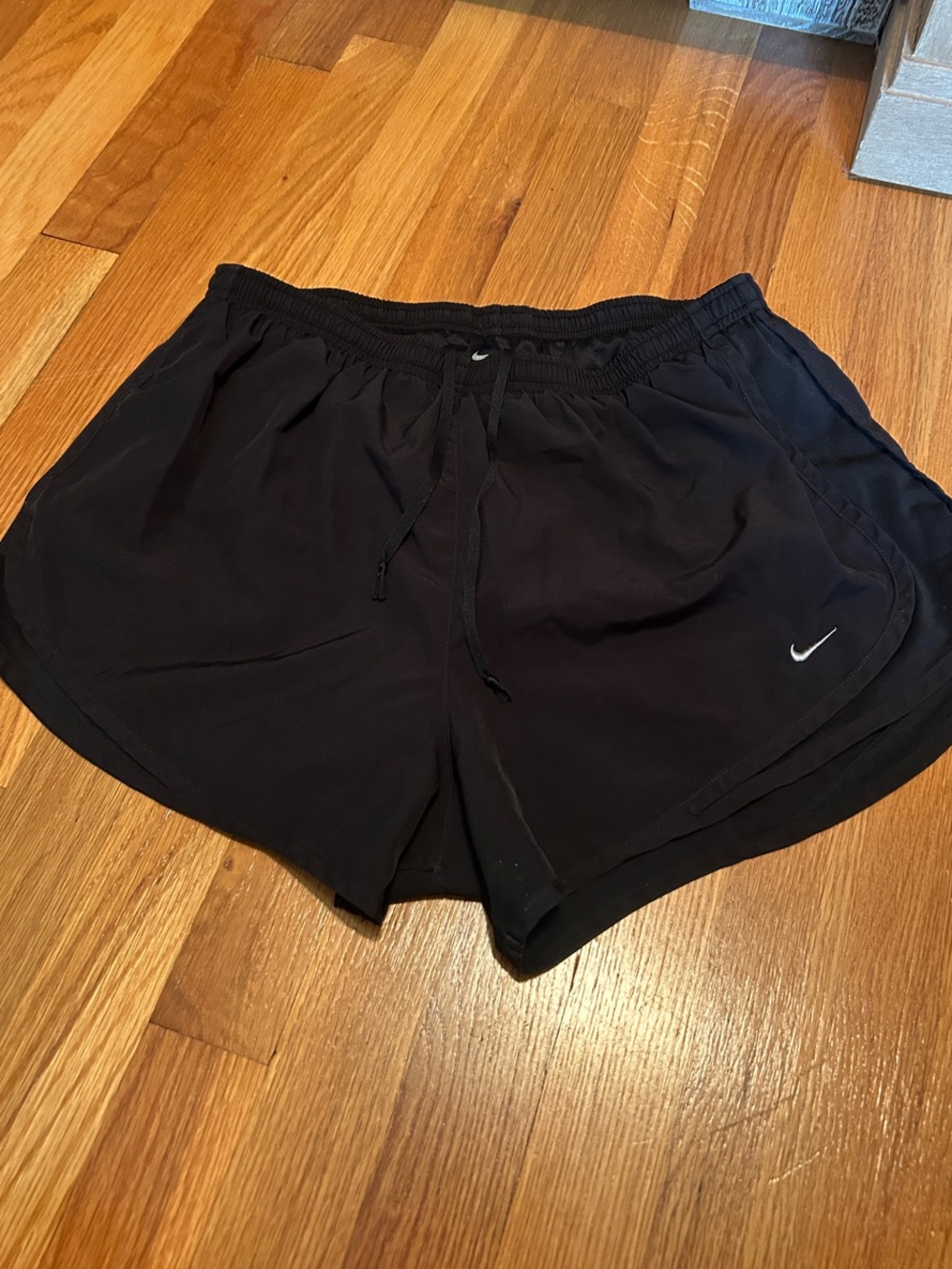 Nike Black Women's Athletic Running Shorts with White Swoosh and lining. Dri-fit